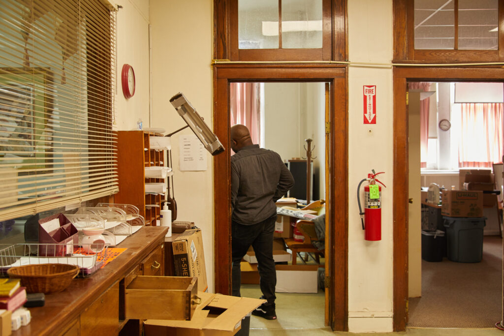 Rev Kendrick stands in his office doorway