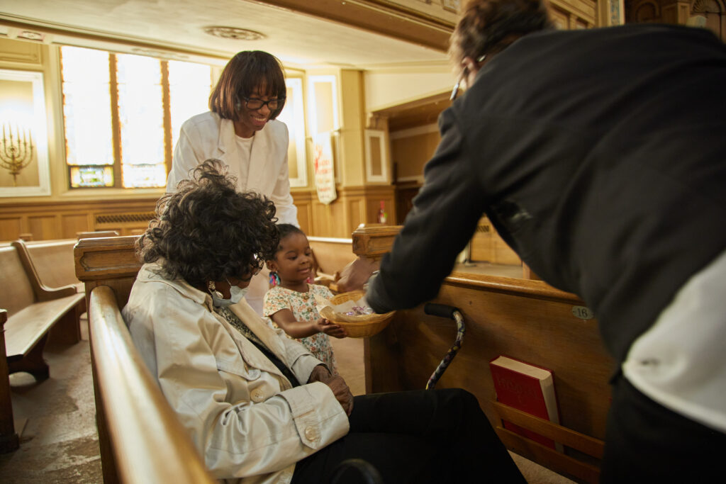 Cory church members preparing and serving communion.