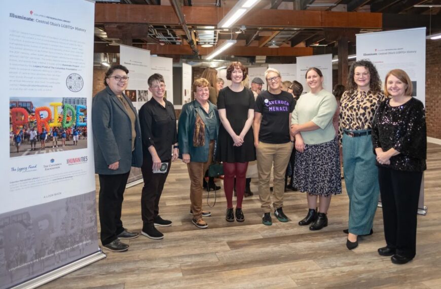 The team that curated the Illuminate exhibit, including two 2025 summer research fellows, poses for a photo next to the opening panel at the Legacy Fund of The Columbus Foundation's 25th anniversary event at Stonewall Columbus in November 2025.